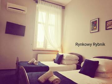Фото номера Двухместный номер с 2 отдельными кроватями Апарт-отели Forum - Rynkowy г. Рыбник 4